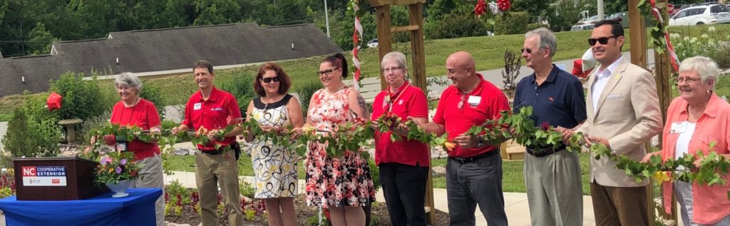 Ribbon cutting during the garden dedication.